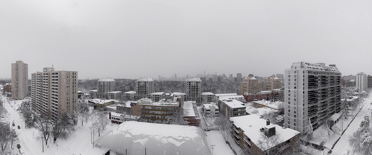 Flat pale grey cloud over a heavily snow covered scene, the skyline a faint grey outline in very low contrast.