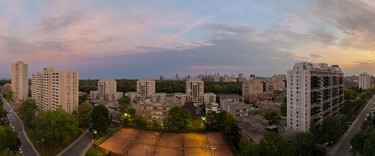Soft pink and mauve cover the whole sky after sunset with the court lights on below.