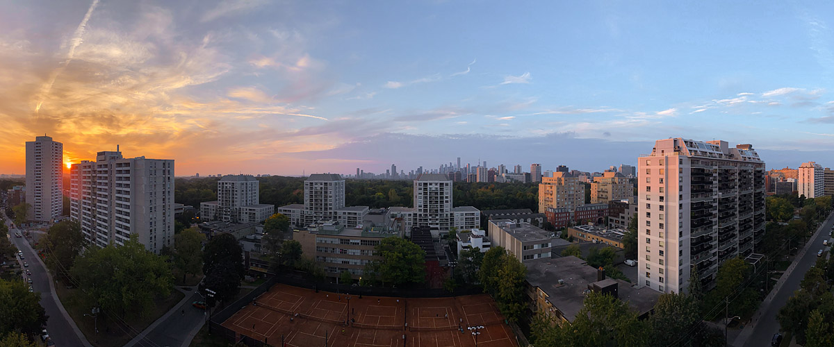 Gold light fills the left of the sky with pink streaks reaching across and blue at the right.