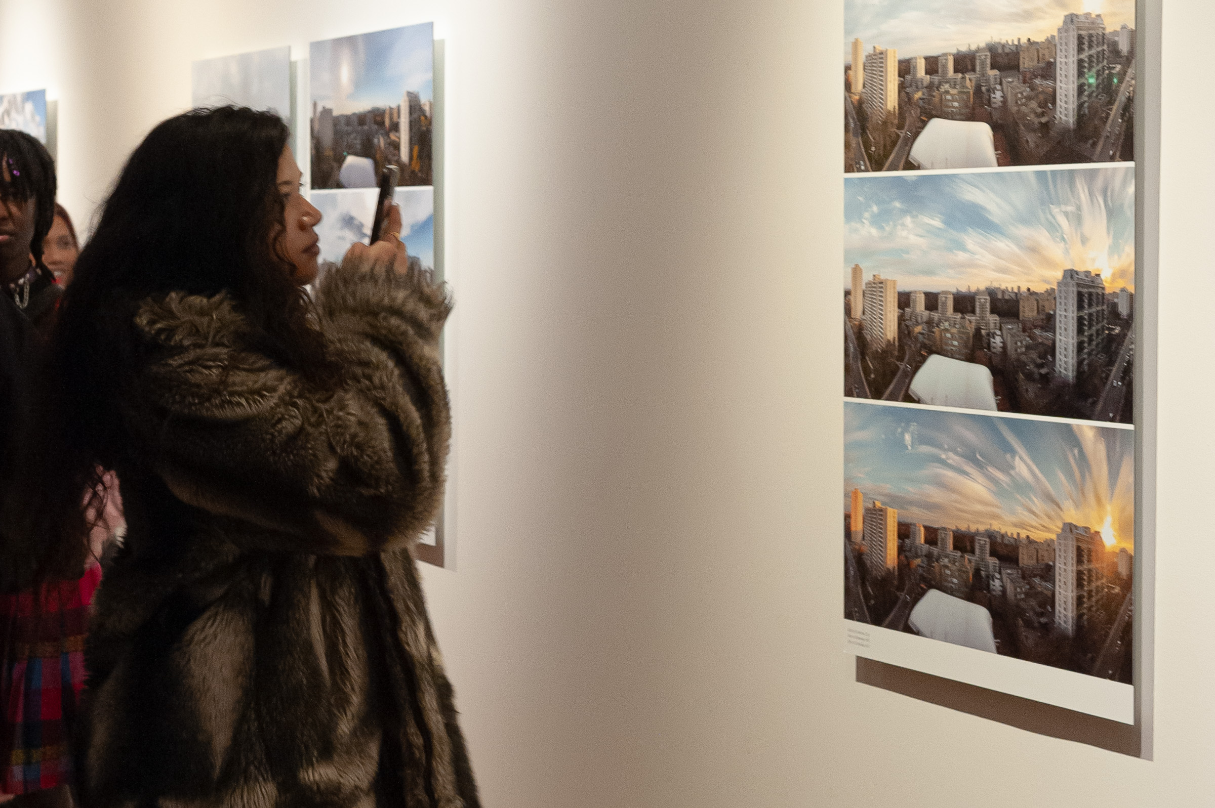 A visitor photographs a Shift with her phone.