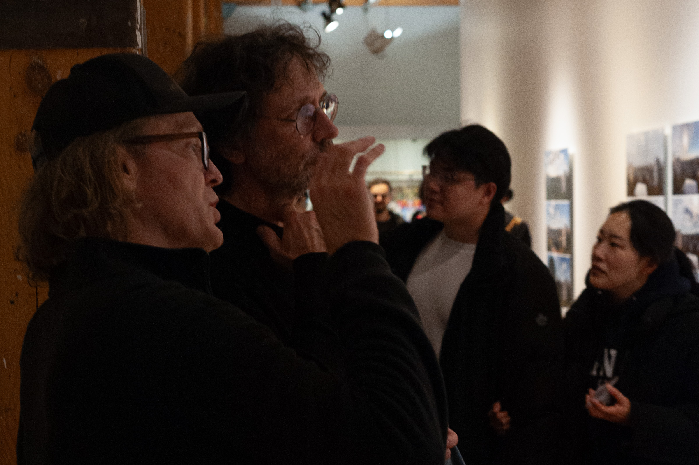 Steven Johnson talks with a visitor in the corridor.