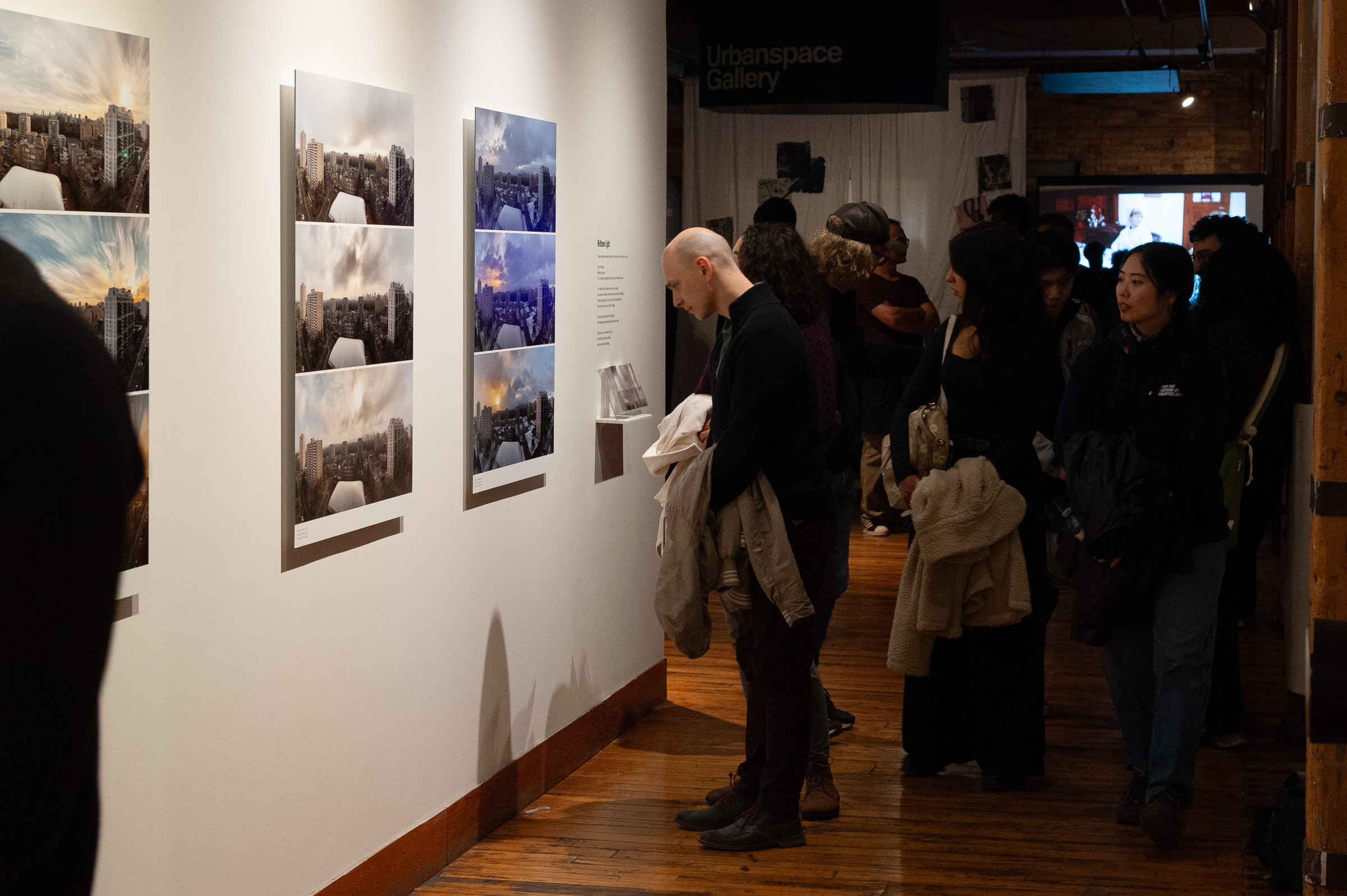 Near midnight, visitors still fill the corridor by the gallery entrance.