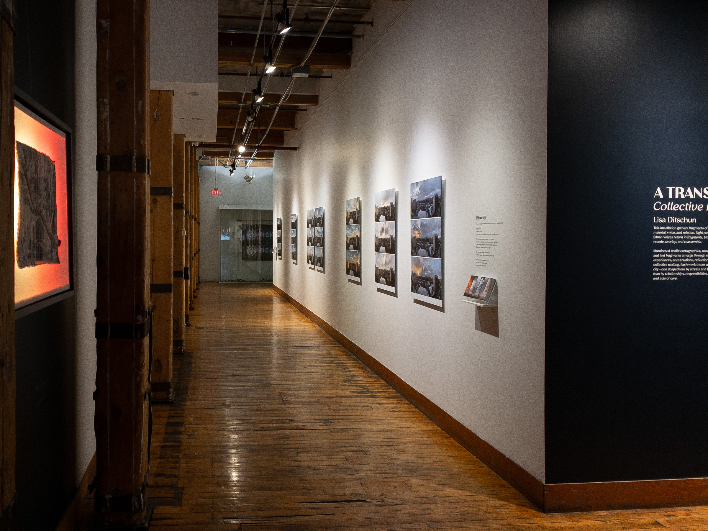 The corridor seen from outside the exhibition, with the Midtown Light wall text and the works visible beyond the wider 401 Richmond gallery space.